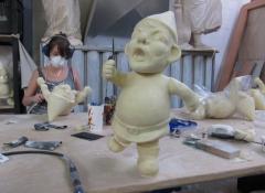 Cleaning seams on plastic cast gnomes, Fabrication South Africa