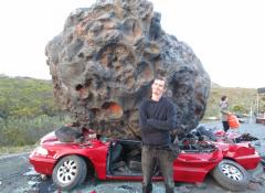 Fabricated meteorite, and crushed car. Fabrication and smoke, Cape Town