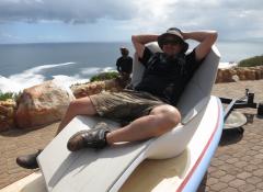 Kobe, in the surf simulating rig, with custom made large scale surf board and chair