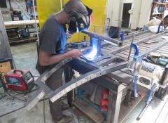 Welding behind a welding screen, in a metal only area with eye protection