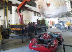 Fabricated meteorite, and crushed car. Fabrication and smoke, Cape Town