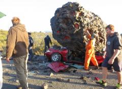 Fabricated meteorite, and crushed car. Fabrication and smoke, Cape Town