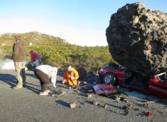 Fabricated meteorite, and crushed car. Fabrication and smoke, Cape Town