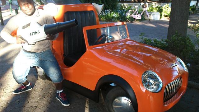 Gabriel posing next to the Jacob car that he helped build Gabriel being a special effects artist, South Africa